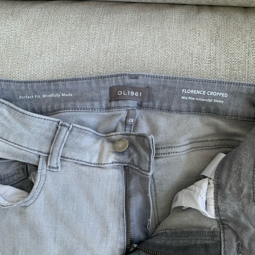 Light gray jeans mid-rise.frayed @ the bottom